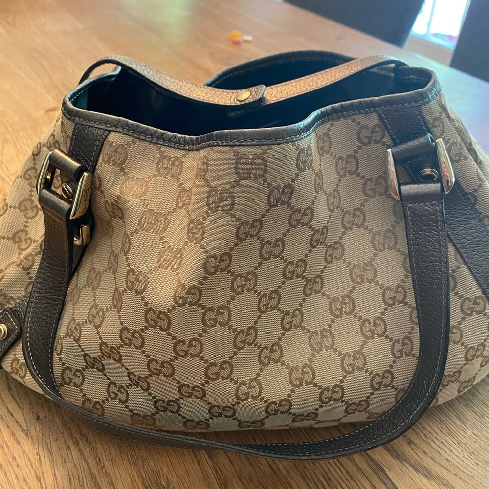 Gucci logo handbag with gold metallic trim